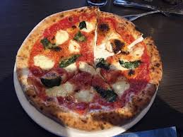 Nick's Italian Ristorante signature dishes Baked Goat Cheese (with fire-roasted tomatoes), Pollo Alla Toscana, Orange Roughy Milanese, and Margherita Pizza.